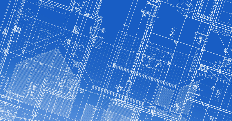 People working on drawing a blueprint.